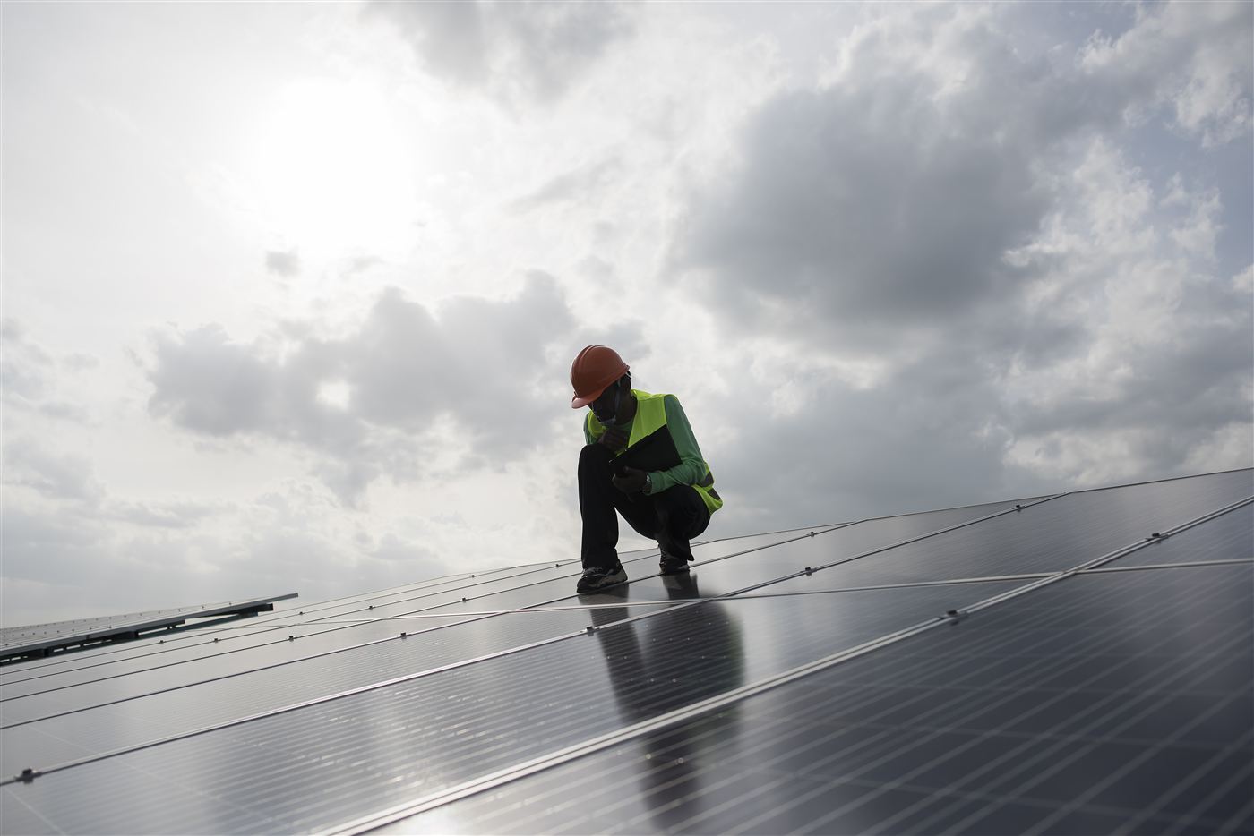 Technician checking solar cell panel maintenance